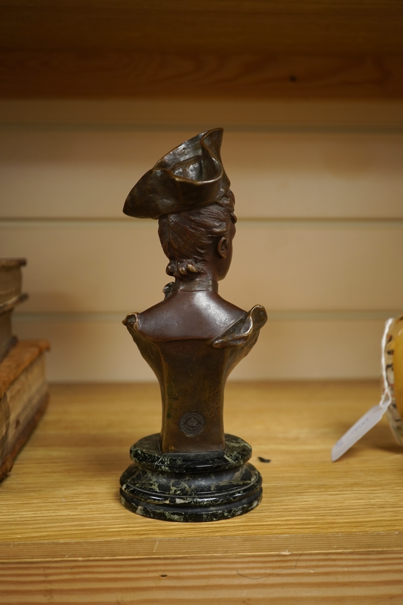 George Van Der Straeten (Belgium, 1856-1928) A bronze bust of a lady wearing a hat, signed, mounted on marble base, 21.5cm high